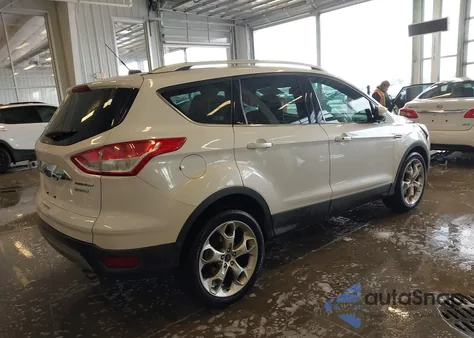 2016 Ford Escape Titanium z USA, uszkodzony, nr VIN 1FMCU0J92GUA29836